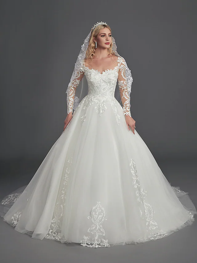 Detail of the lace appliques on the bodice and sleeves of the wedding gown.
