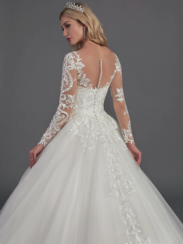 Close-up of the delicate button details along the back of the wedding dress.