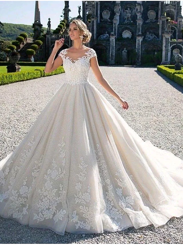 Close-up of Lace Tulle and Appliques on Wedding Dress.