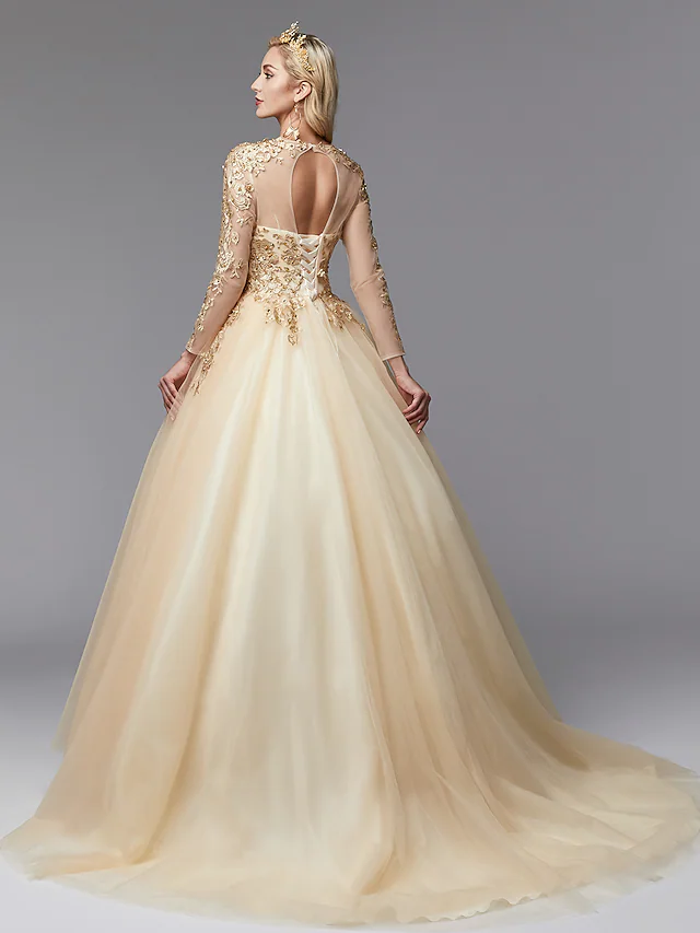 Close-up of the jewel neck and long lace sleeves of the white ball gown wedding dress.