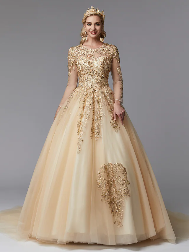 Back view of the white ball gown wedding dress, highlighting the see-through lace and beaded appliques.