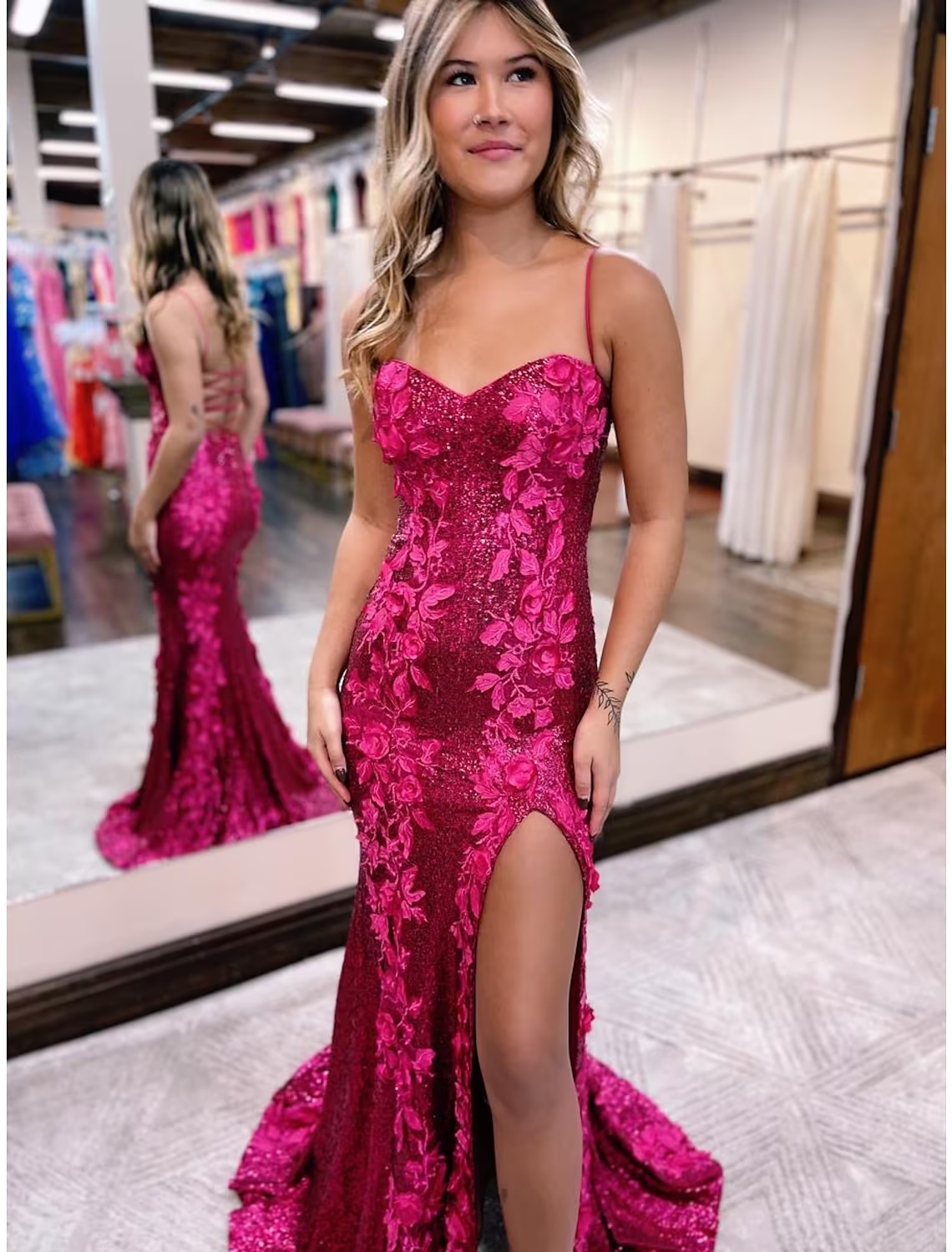 Side profile of the mermaid trumpet evening gown, showcasing the silhouette and sweep train.