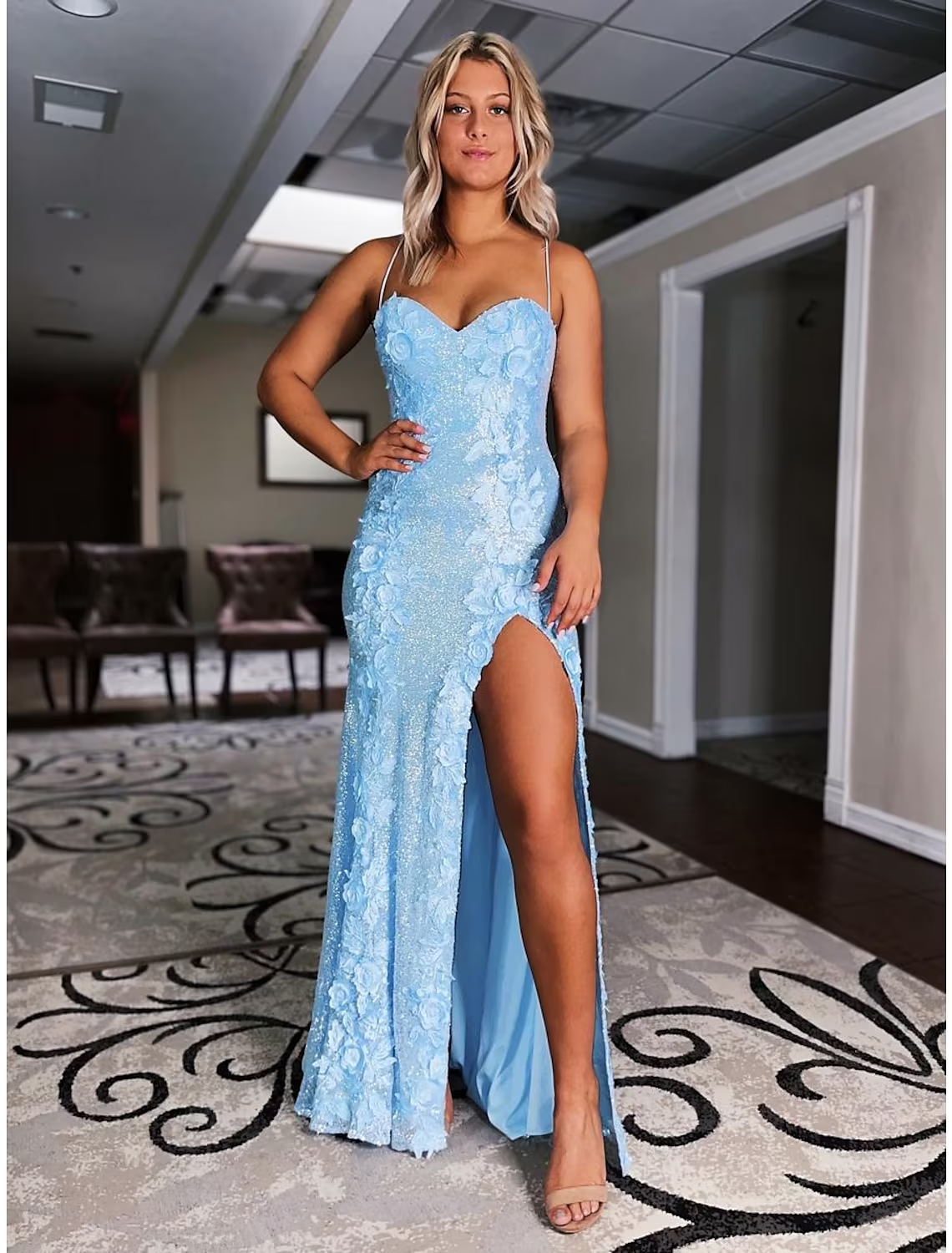 Back view of the sequined backless mermaid trumpet gown.