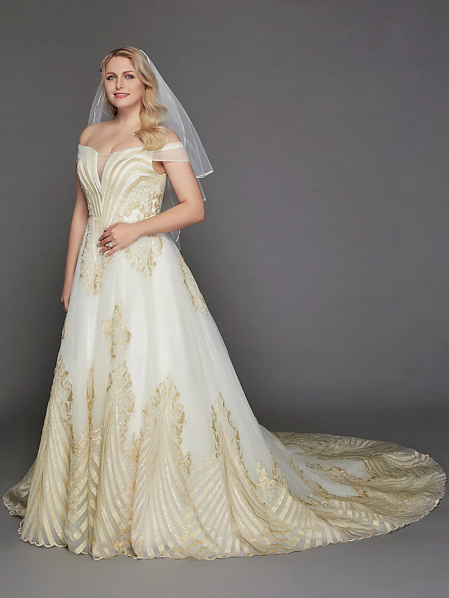 Front view of a glamorous princess off-shoulder wedding dress with lace and tulle.