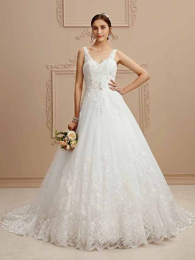 Side view of ball gown wedding dress with full skirt and court train.