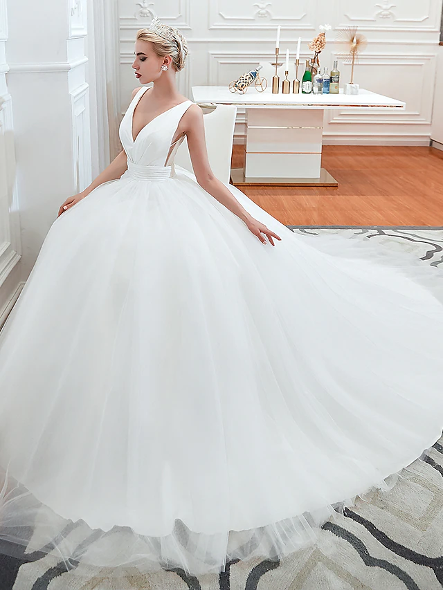 Side view of the elegant tulle ball gown wedding dress.