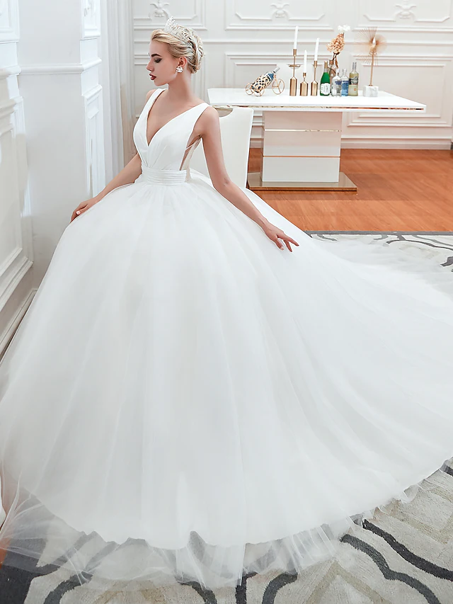 Detail of the regular straps and ruched fabric on the wedding dress.