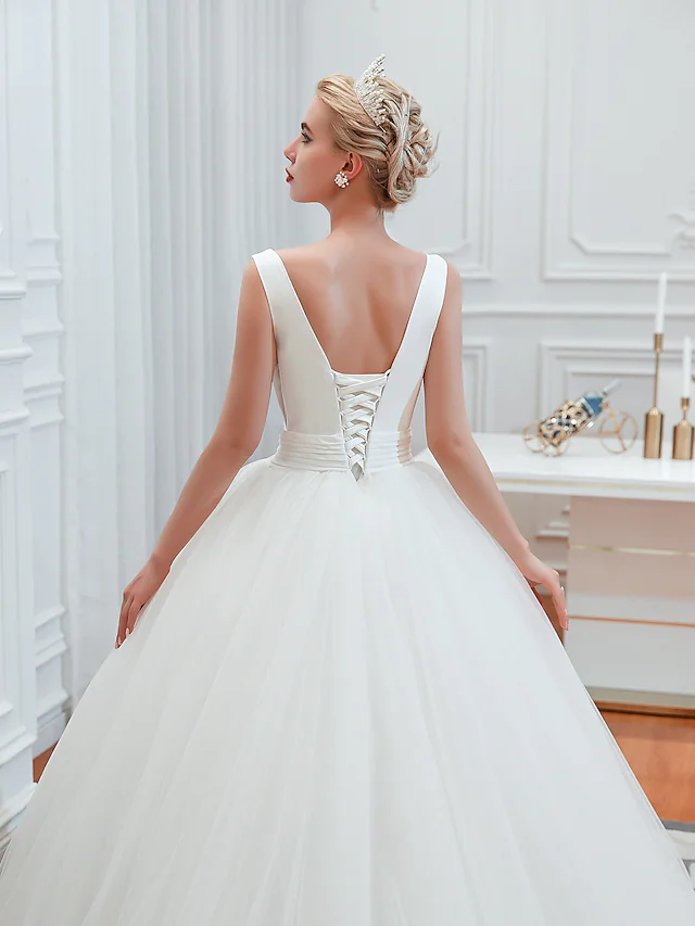 Full length view of the glamorous V-neck wedding dress.