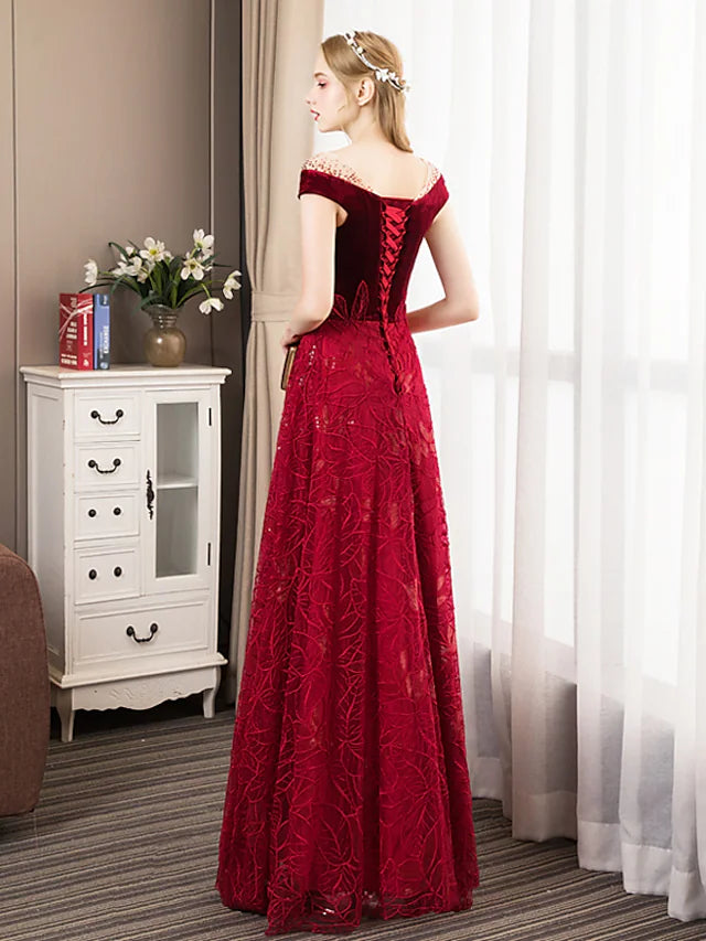 Close-up of the glittering tulle bodice with crystal embellishments on the prom dress.