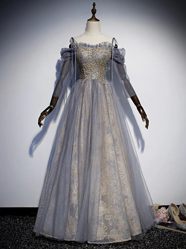 Glittering A-Line prom dress with spaghetti straps and sequin embroidery.