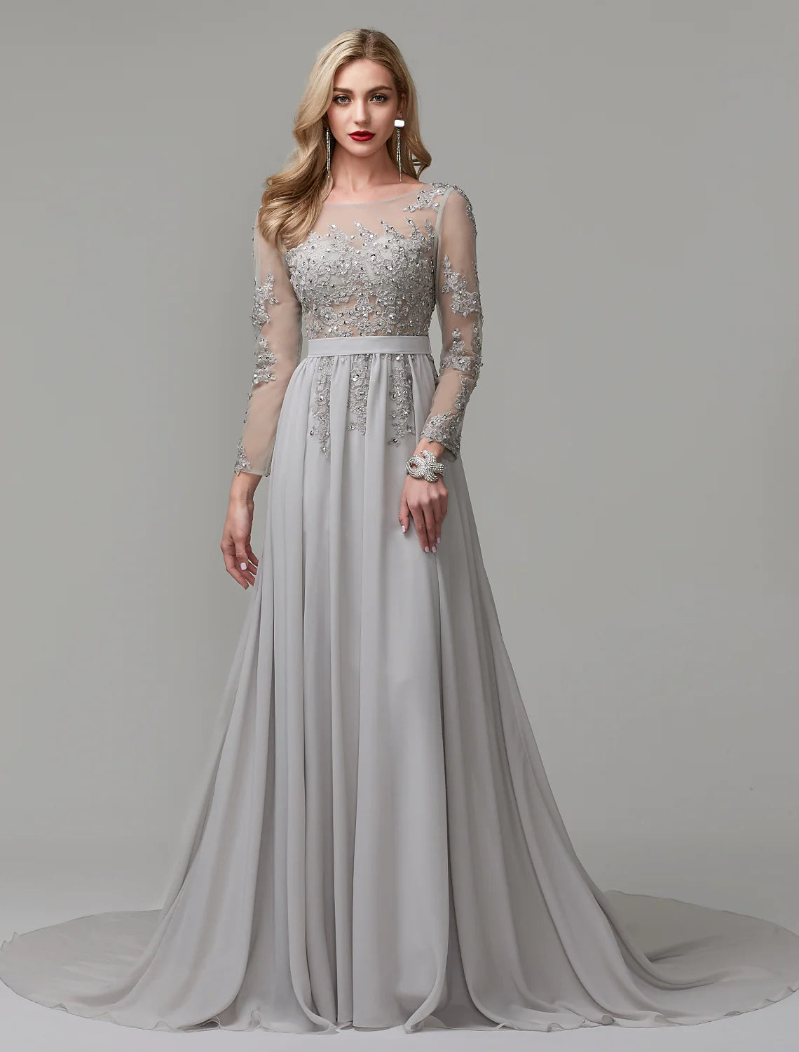 Elegant A-line formal evening dress with illusion neckline and long sleeves.