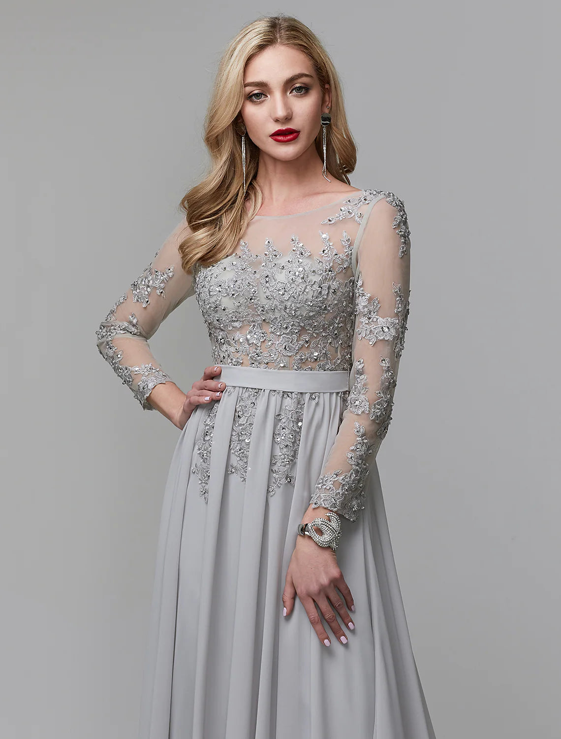 Close-up of sequin appliques on chiffon fabric of the formal dress.