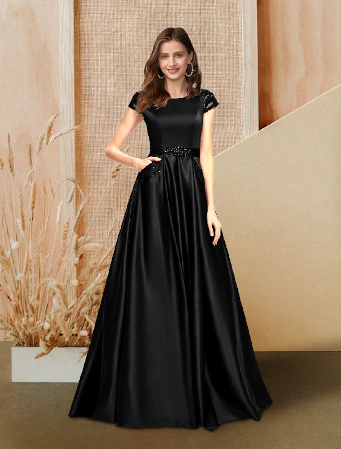 Elegant A-Line evening gown with jewel neck and short sleeves.