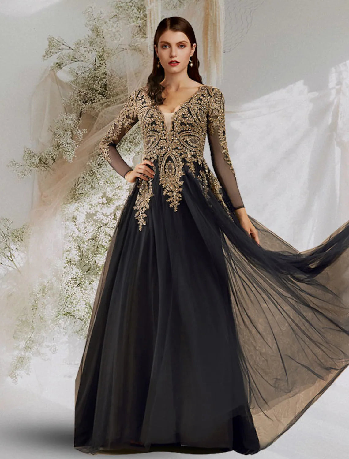 Navy V-neck long sleeve ball gown with sequin appliques on tulle fabric.