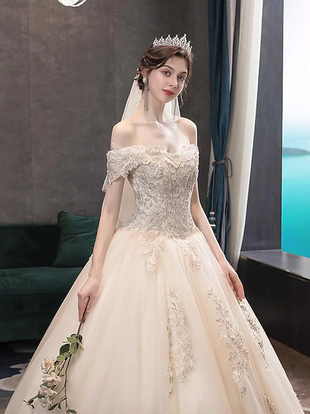 Back view of the floor-length ball gown wedding dress.