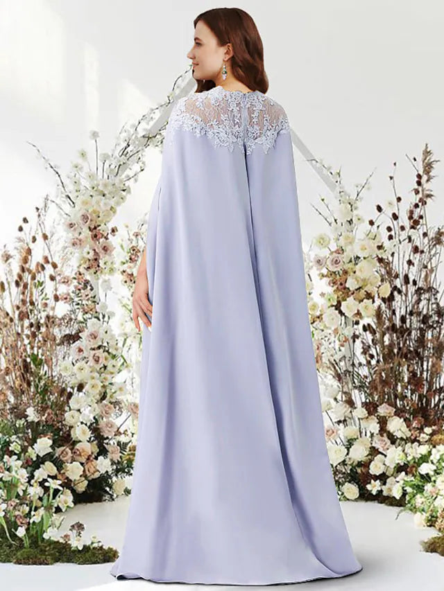 Side profile of a woman showcasing the elegant drape of the two-piece gown.