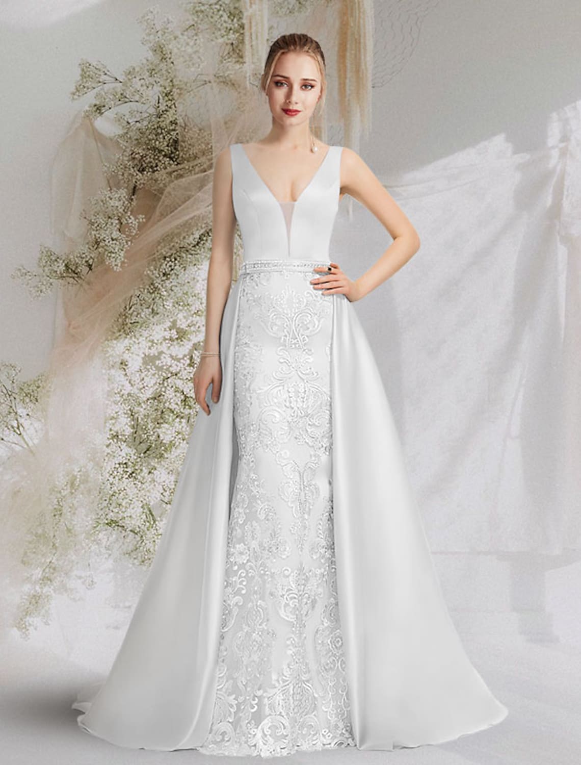 Full length view of a blue satin mermaid trumpet formal gown with intricate appliques.