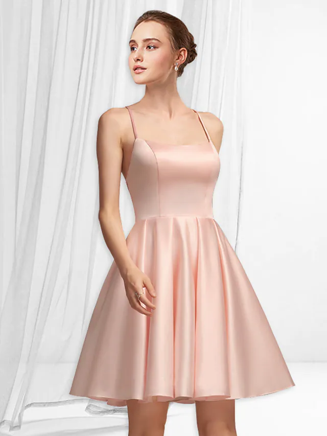 Minimalist A-line satin mini dress with spaghetti straps and pleats.