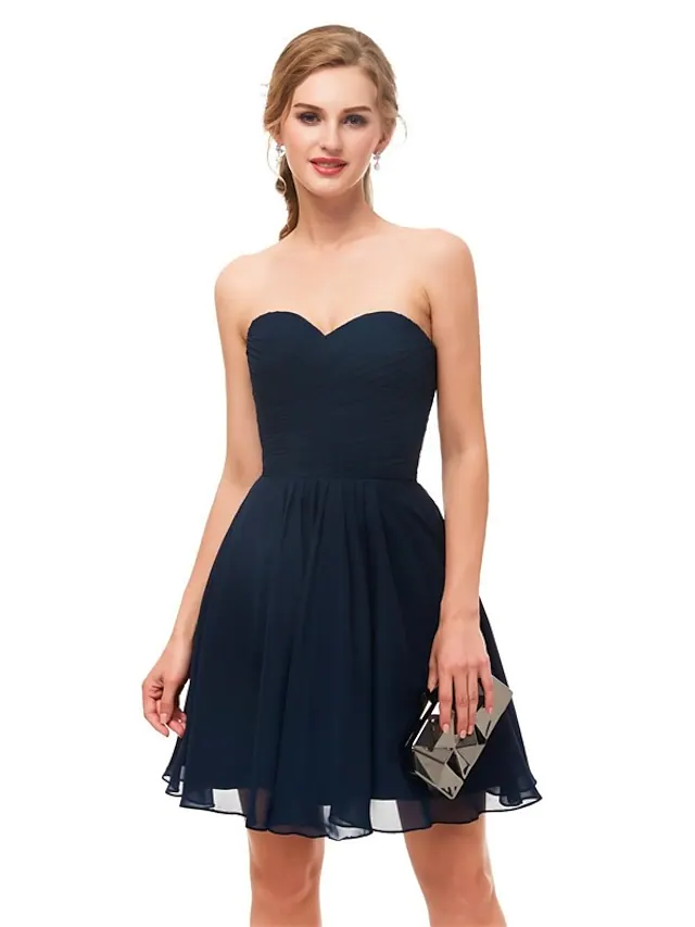 A-line strapless knee-length cocktail dress in a solid color.