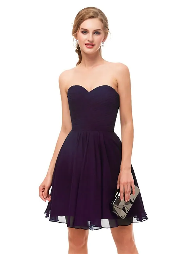 Full view of the elegant strapless knee-length dress.
