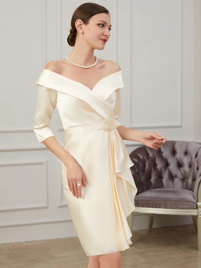 Knee-length polyester dress for mother of the bride, featuring ruched details.