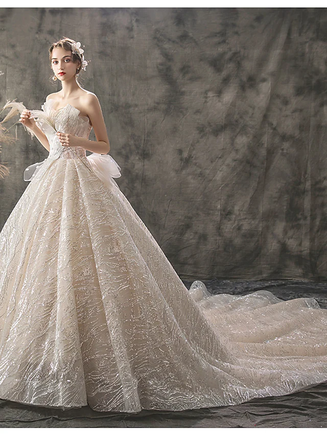Back view of a princess ball gown wedding dress with chapel train.
