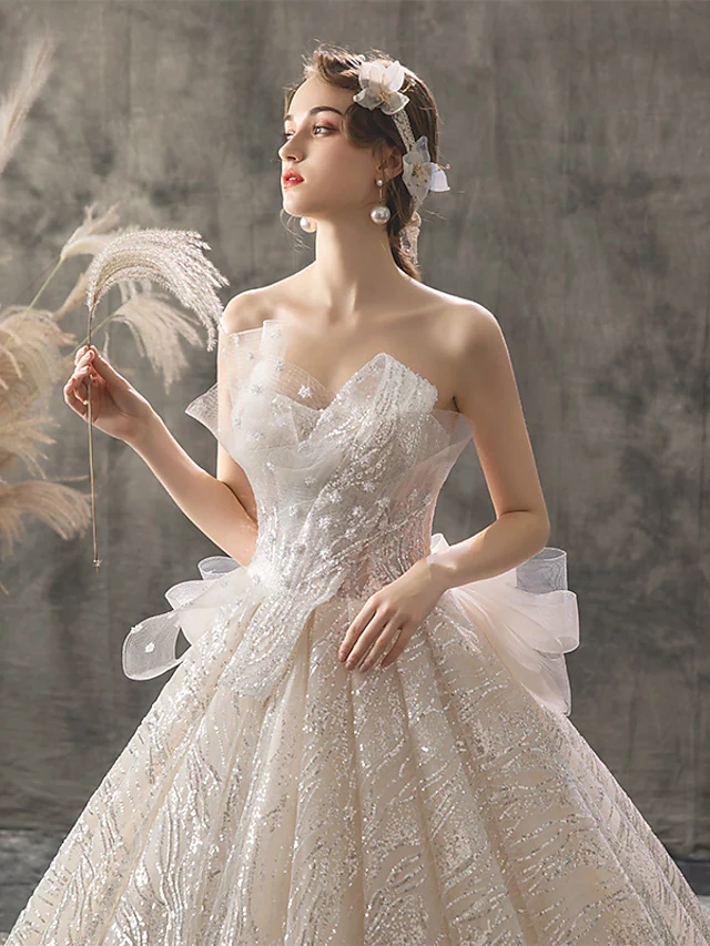 Full length view of a luxurious sequined wedding ball gown.