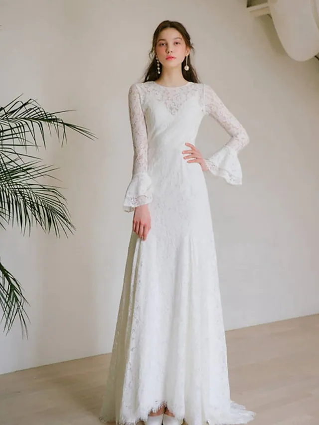 Romantic A-Line wedding dress with jewel neck, long lace sleeves, and appliques.
