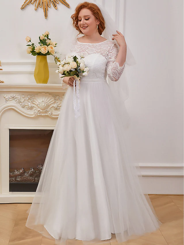 Back view of an A-line wedding dress showing cascading ruffles and floor-length design.