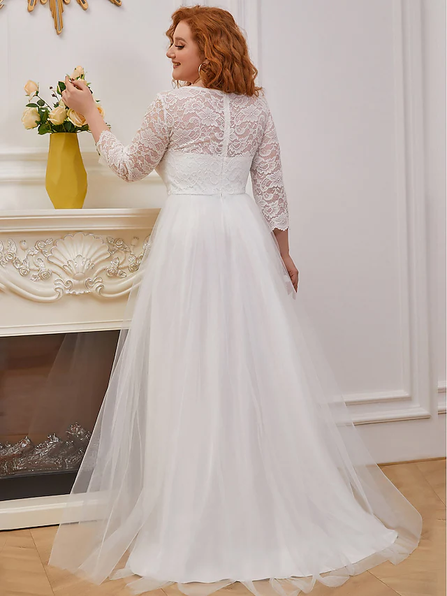 Close-up of the lace detail on the bodice of a jewel neck A-line wedding dress.