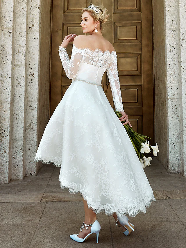 A-line off-shoulder long sleeve lace wedding dress.