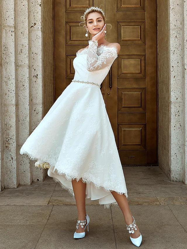 Side profile of the A-line off-shoulder wedding dress.