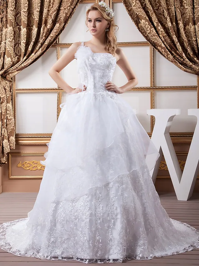 A-Line one-shoulder wedding dress with lace details and a court train.