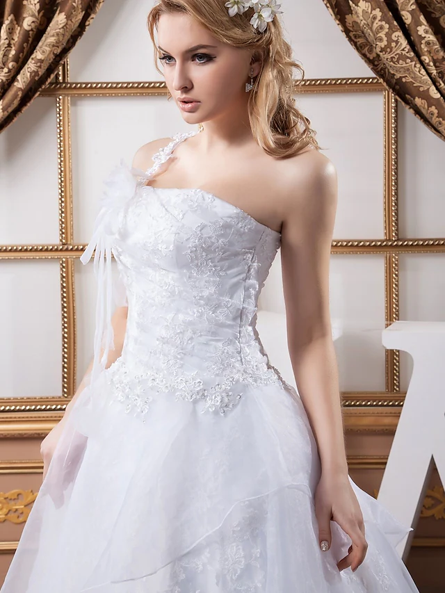 Full length view of A-Line wedding dress with cascading ruffles.