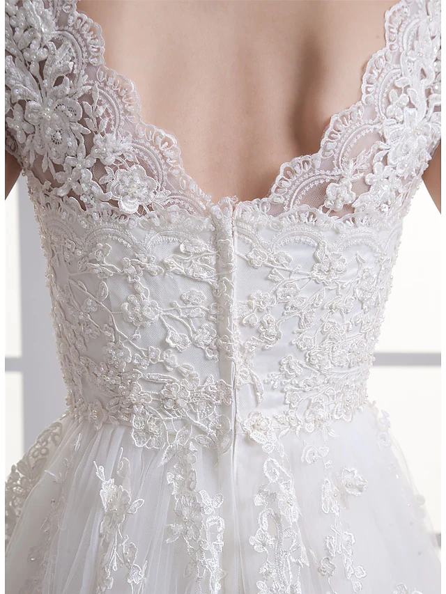 Full length view of the wedding dress with elegant court train.
