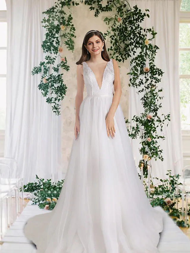 Elegant A-Line V-neck wedding dress with lace, tulle, and sequin details, featuring a court train.