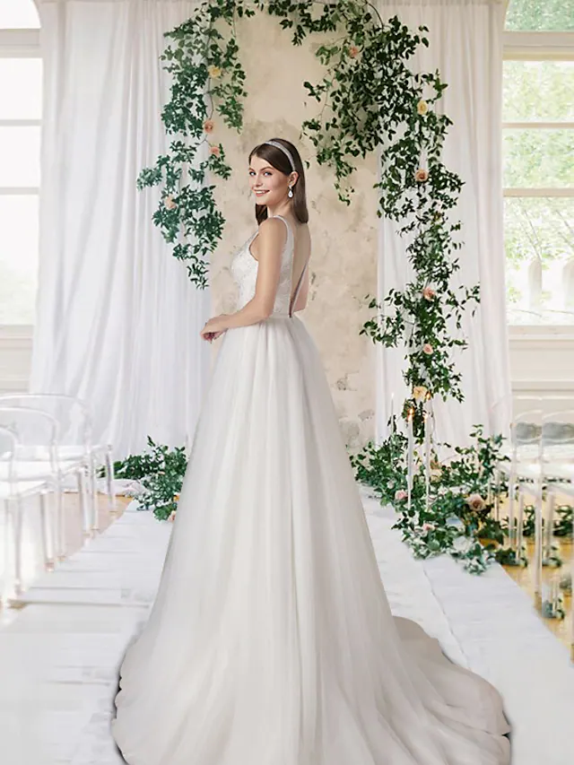 Back view of the A-Line V-neck wedding dress showcasing the court train and lace details.