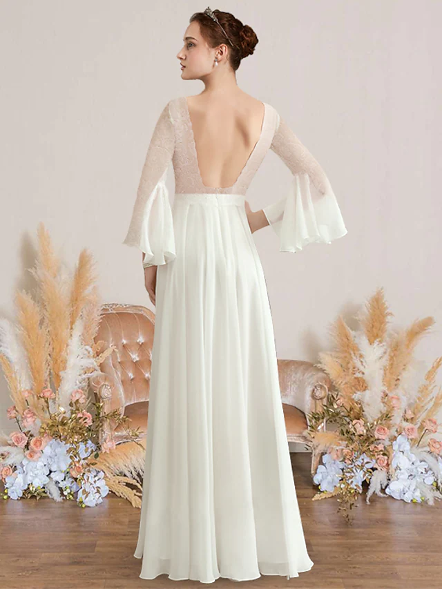 Back view of a romantic A-line bridal gown featuring a V-neck and flowing chiffon.
