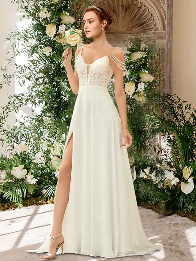 Romantic A-Line wedding dress with sweetheart neckline and spaghetti straps.