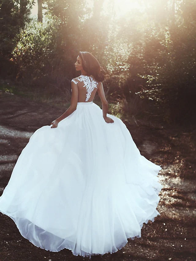 Side view of a romantic A-line wedding dress with V-neck and cap sleeves.