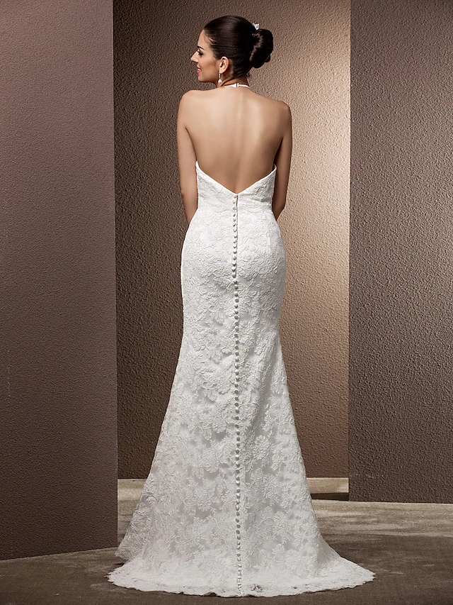 Detail of the halter neckline and lace fabric of the wedding gown.