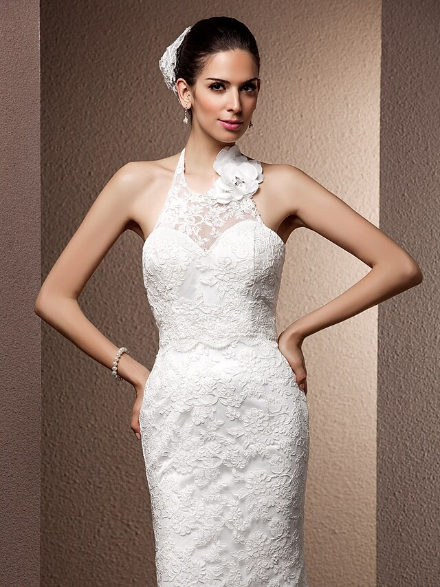Full length view of the wedding dress from a slight angle.