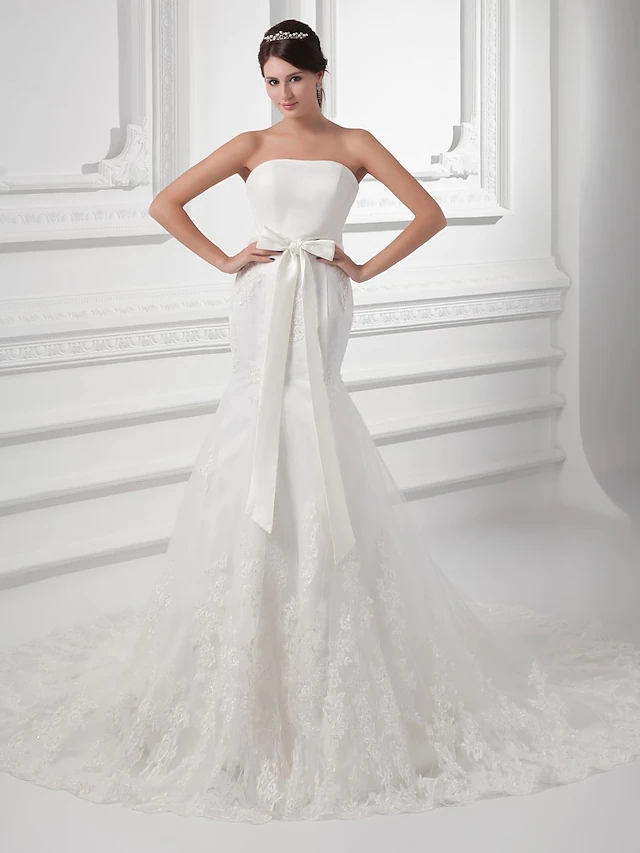 Full length view of a romantic strapless bridal gown.