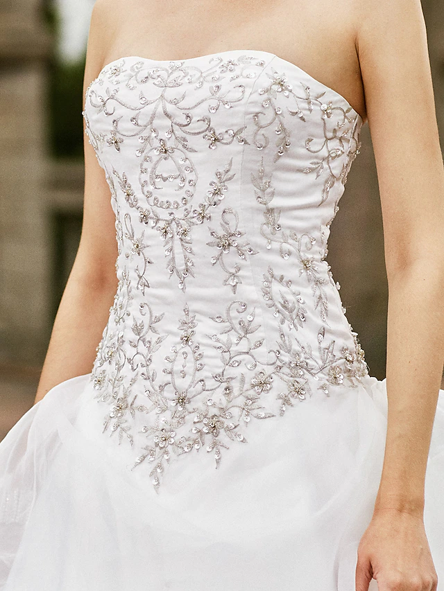 Detail of the unique pick-up skirt design on a romantic organza wedding dress.