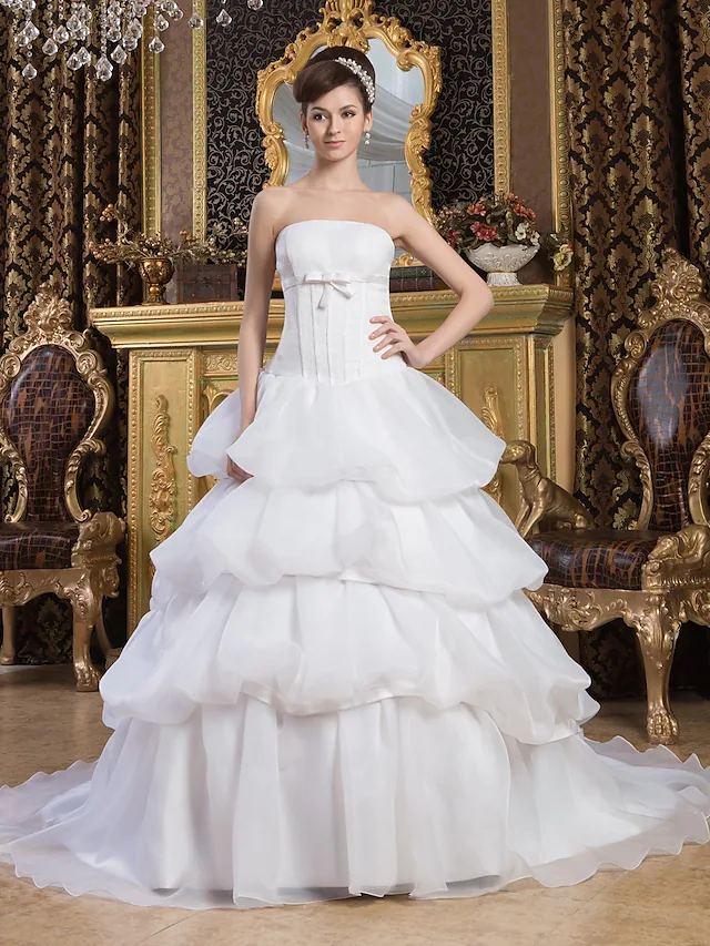 Elegant strapless ball gown wedding dress with a court train.