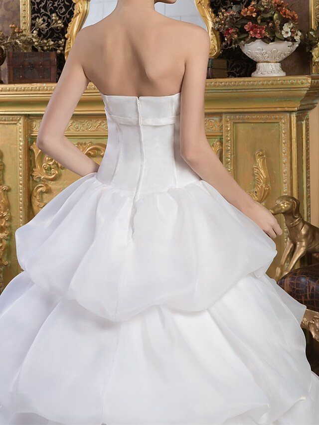 Full view of the romantic ball gown wedding dress.