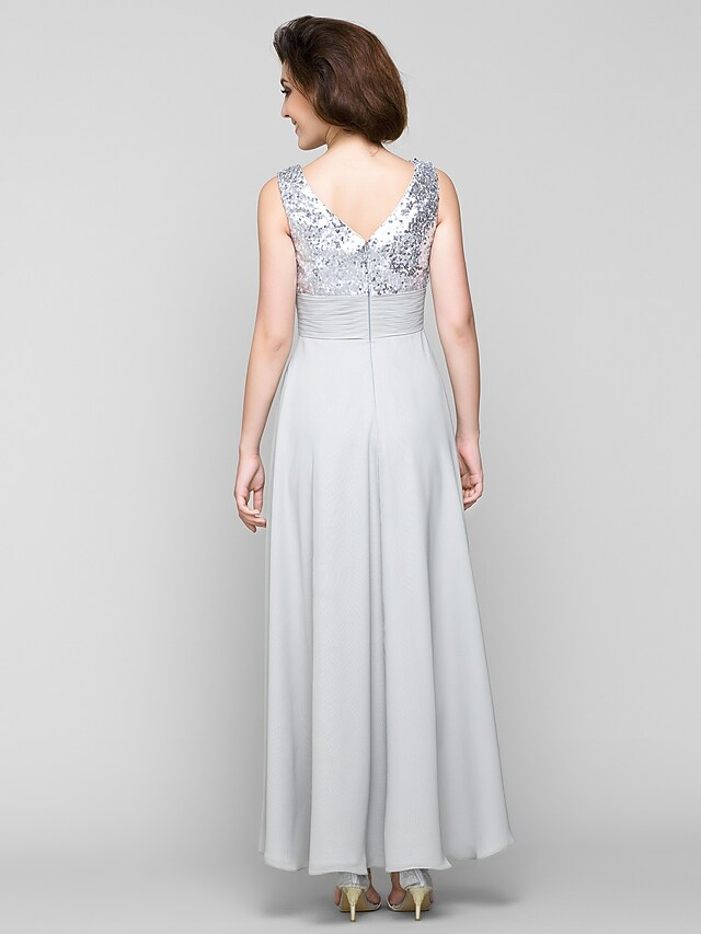 Sleeveless chiffon A-Line gown with sash ribbon.