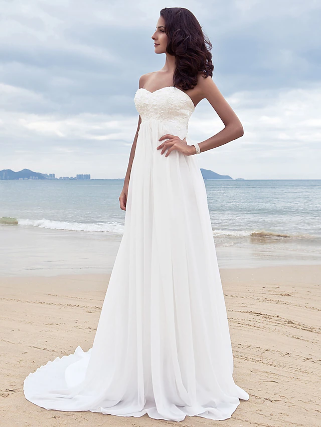Close-up of beading appliques on the chiffon wedding dress.
