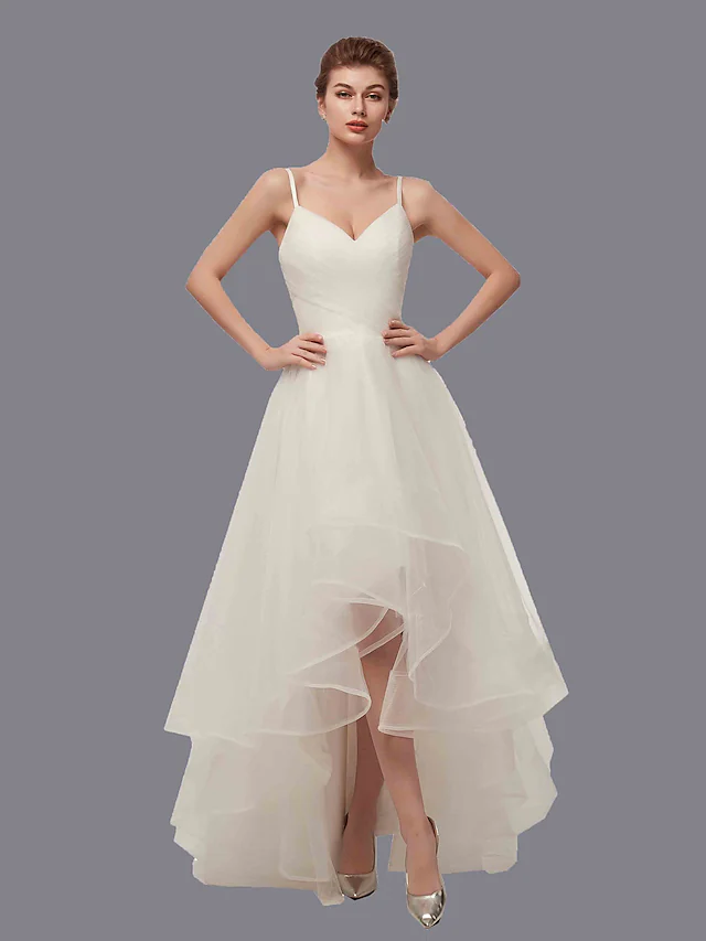 Front view of an A-line V-neck white tulle wedding dress with spaghetti straps and side draping.