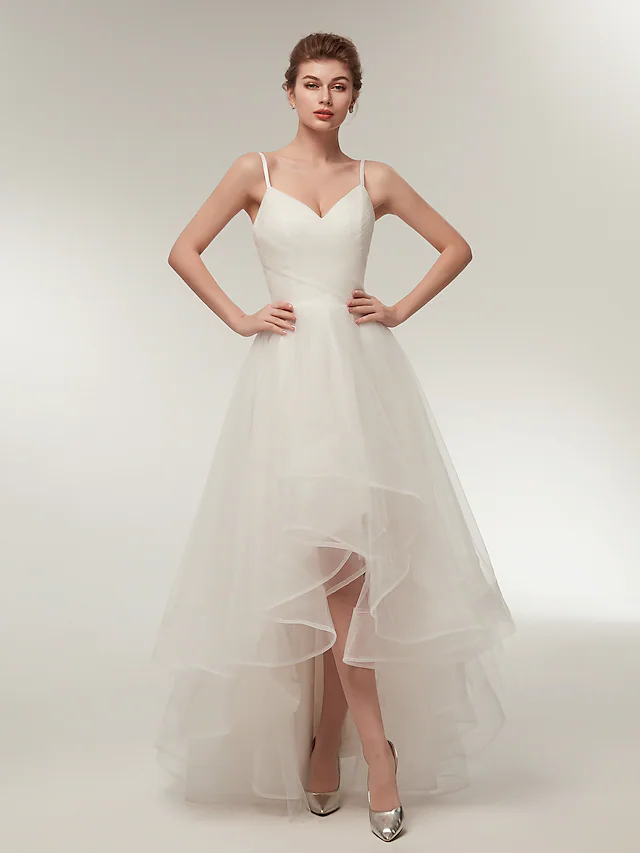 Back view of the white tulle wedding dress, showing the spaghetti straps and V-neckline.
